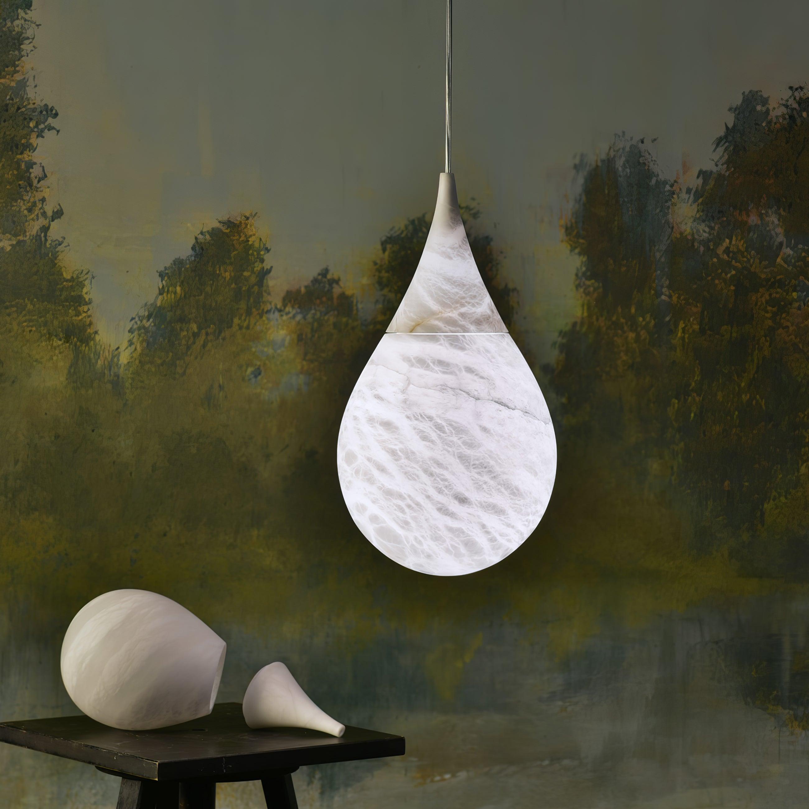 Marble teardrop pendant against a painted wall