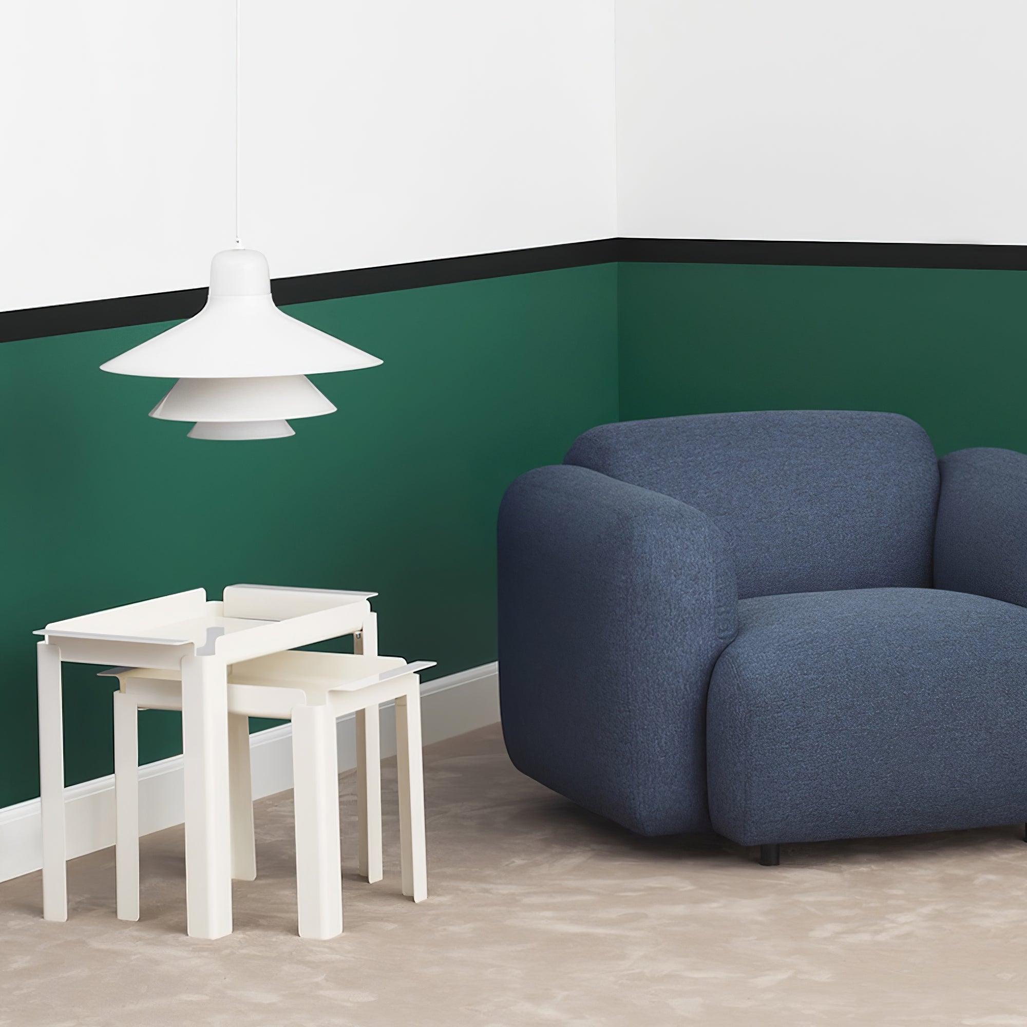 White pendant above nesting tables