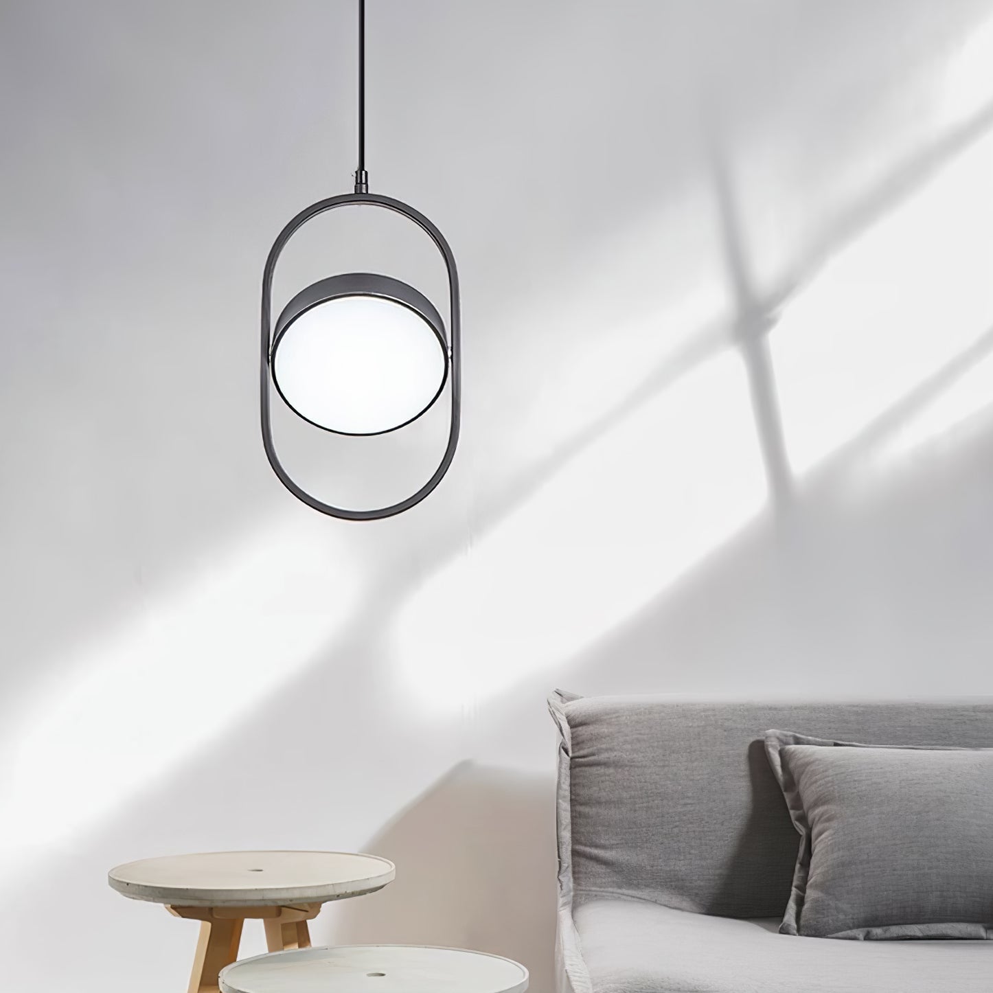 Vertical Black KUU frame casting a wall shadow