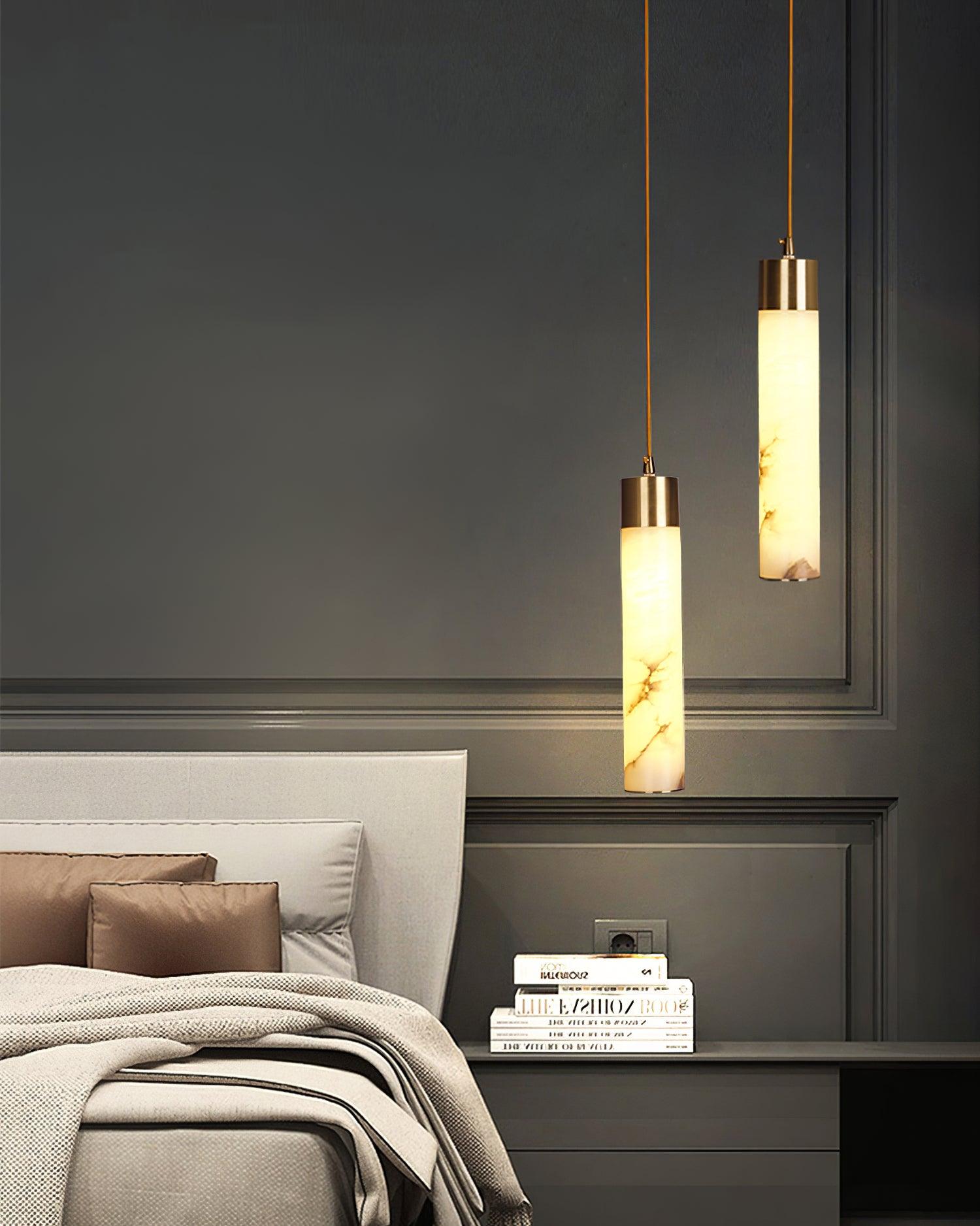 Two slim Tala pendants beside a bedroom nightstand