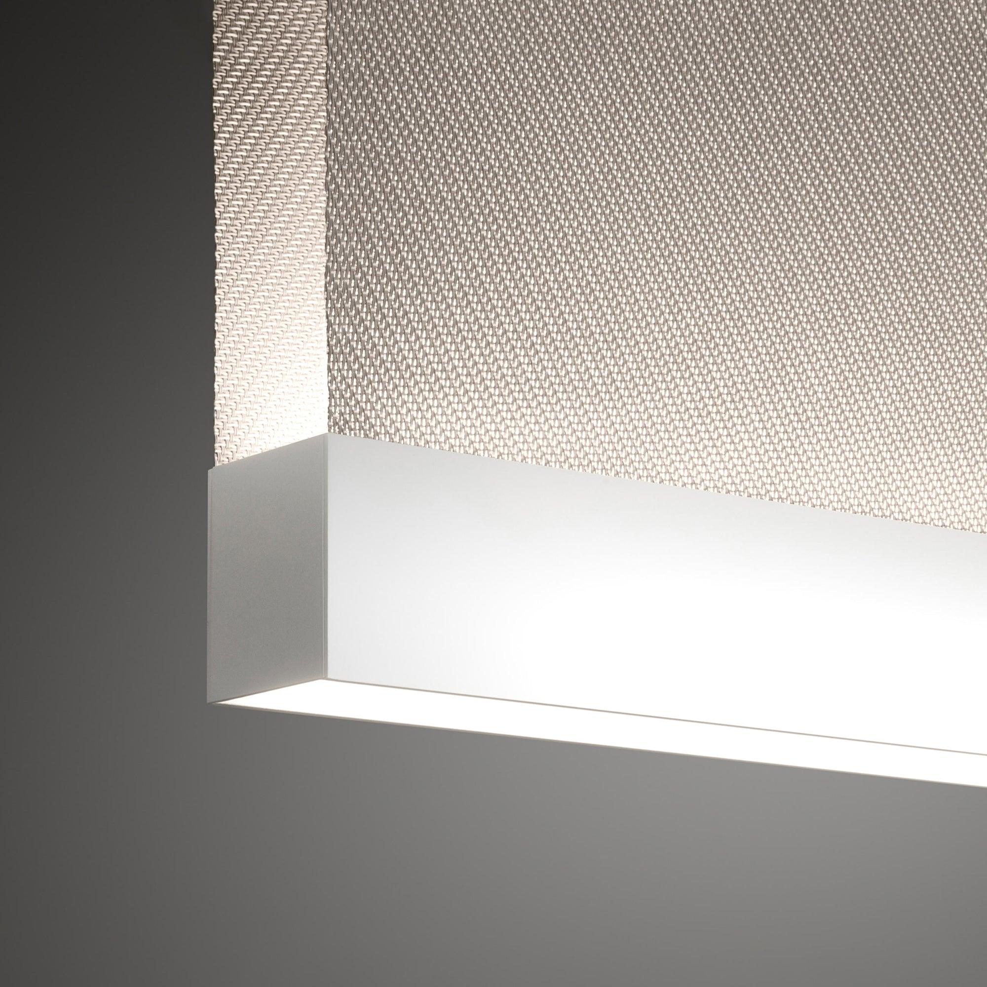 White metal lower rail beneath woven fabric