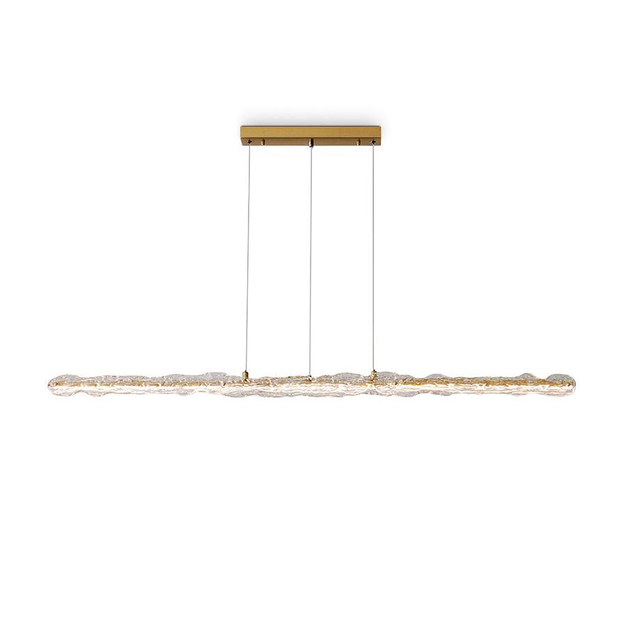 Front view of a clear wavy textured pendant with brass-tone inner strip and rectangular canopy on white