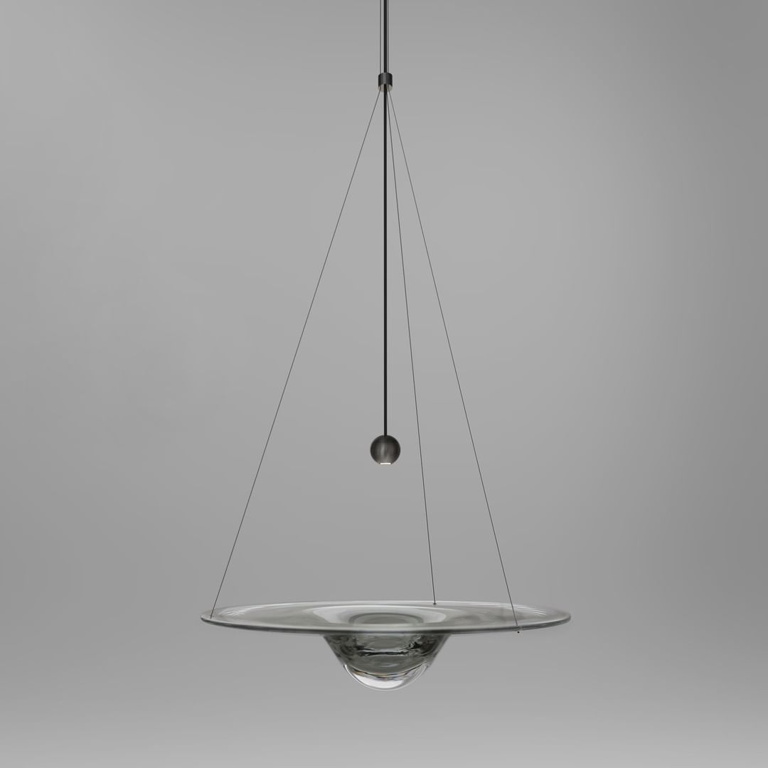 Glass disc pendant with three fine suspension lines