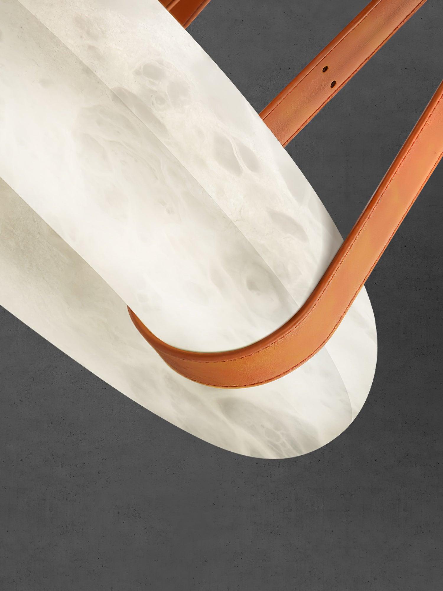 Brown strap wrapping beneath the alabaster ring