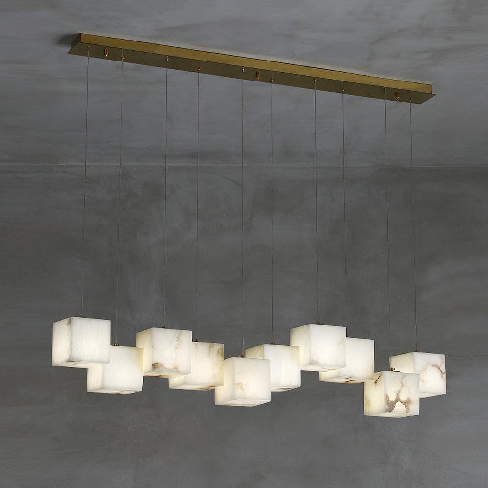 Ten white cube shades forming a staggered linear pendant