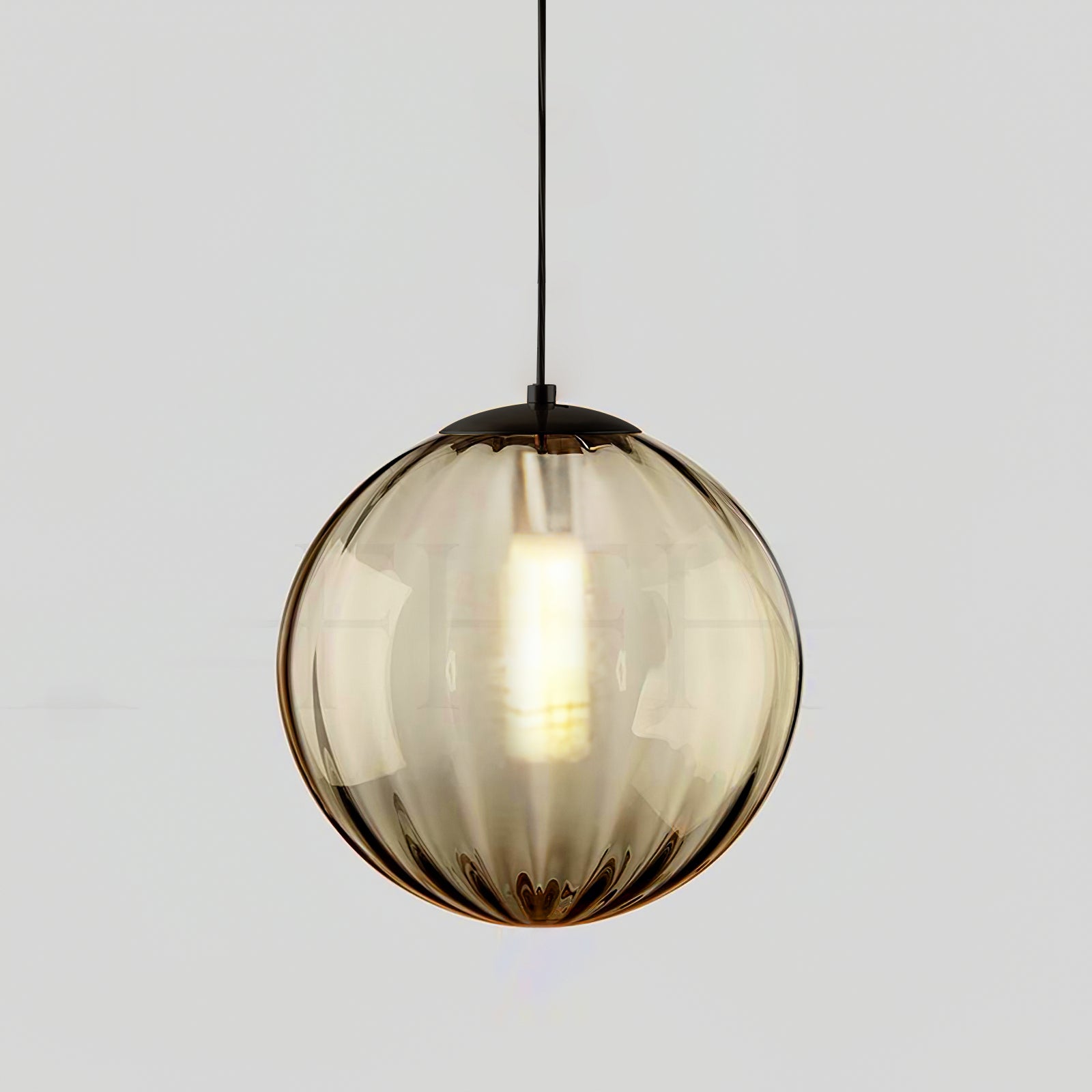 Paola pendant light with a coloured glass globe and small metal cap