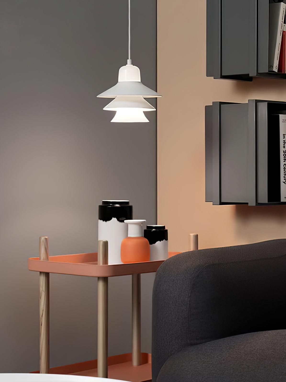 White pendant beside a black wall shelf