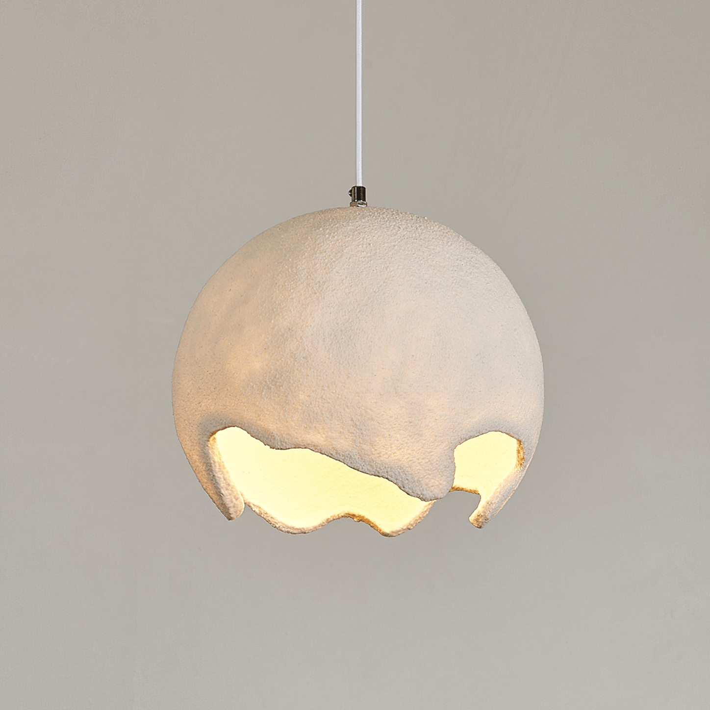 Close view of a lit beige textured shade