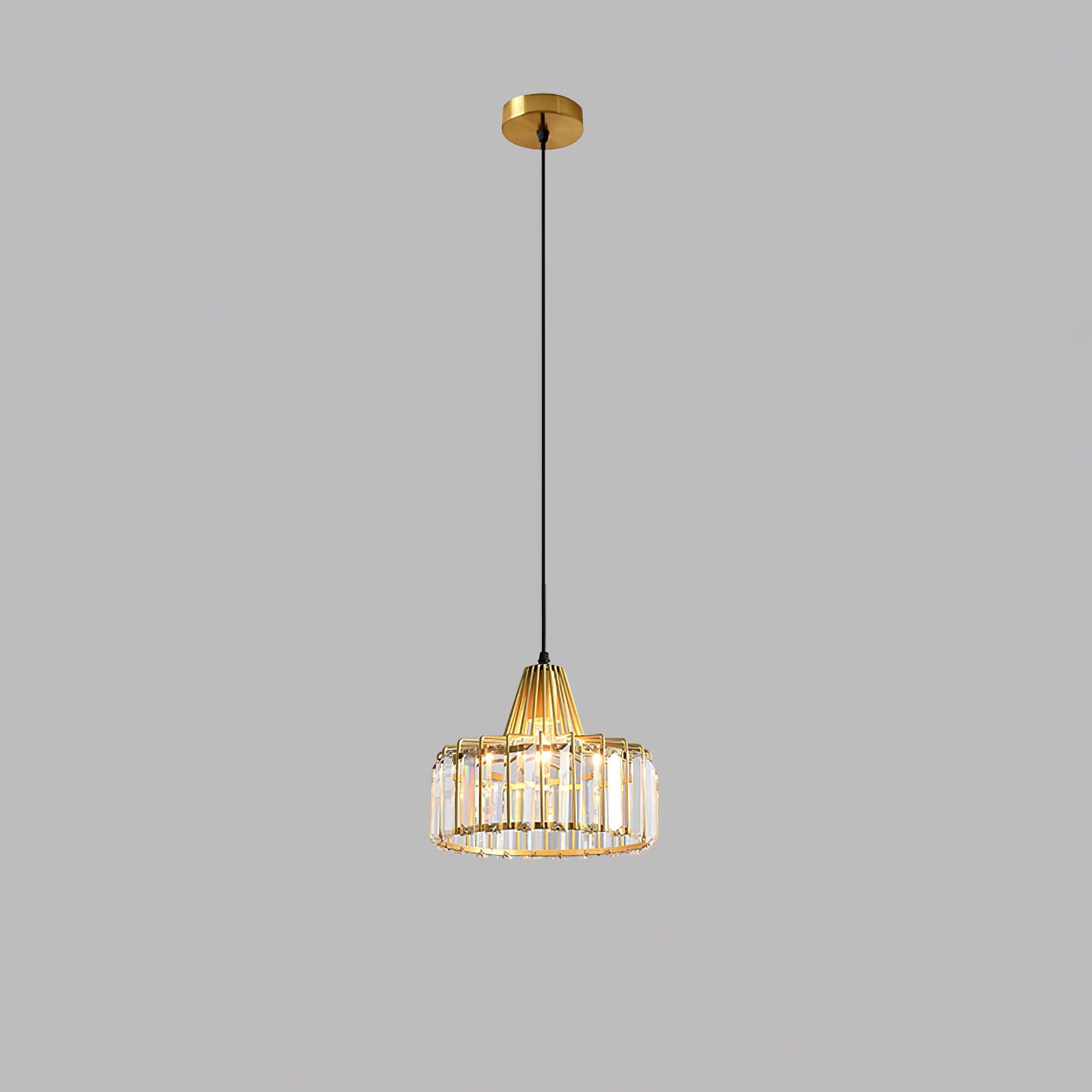 Small gold-coloured drum pendant with clear glass and a round ceiling canopy