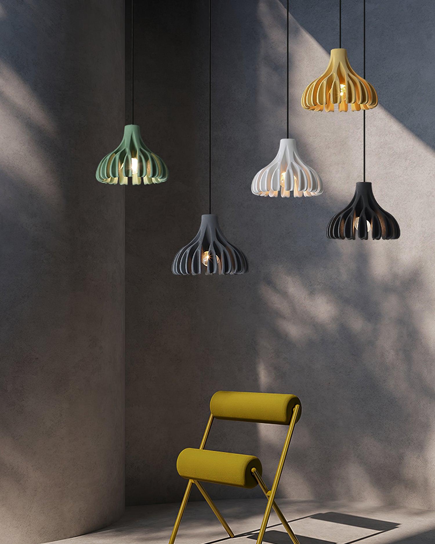 Five coloured resin pendants above a chair