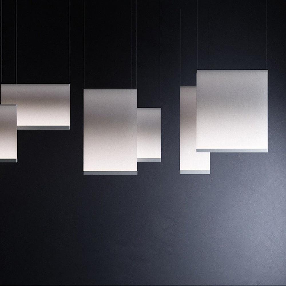 Illuminated panels against a dark wall