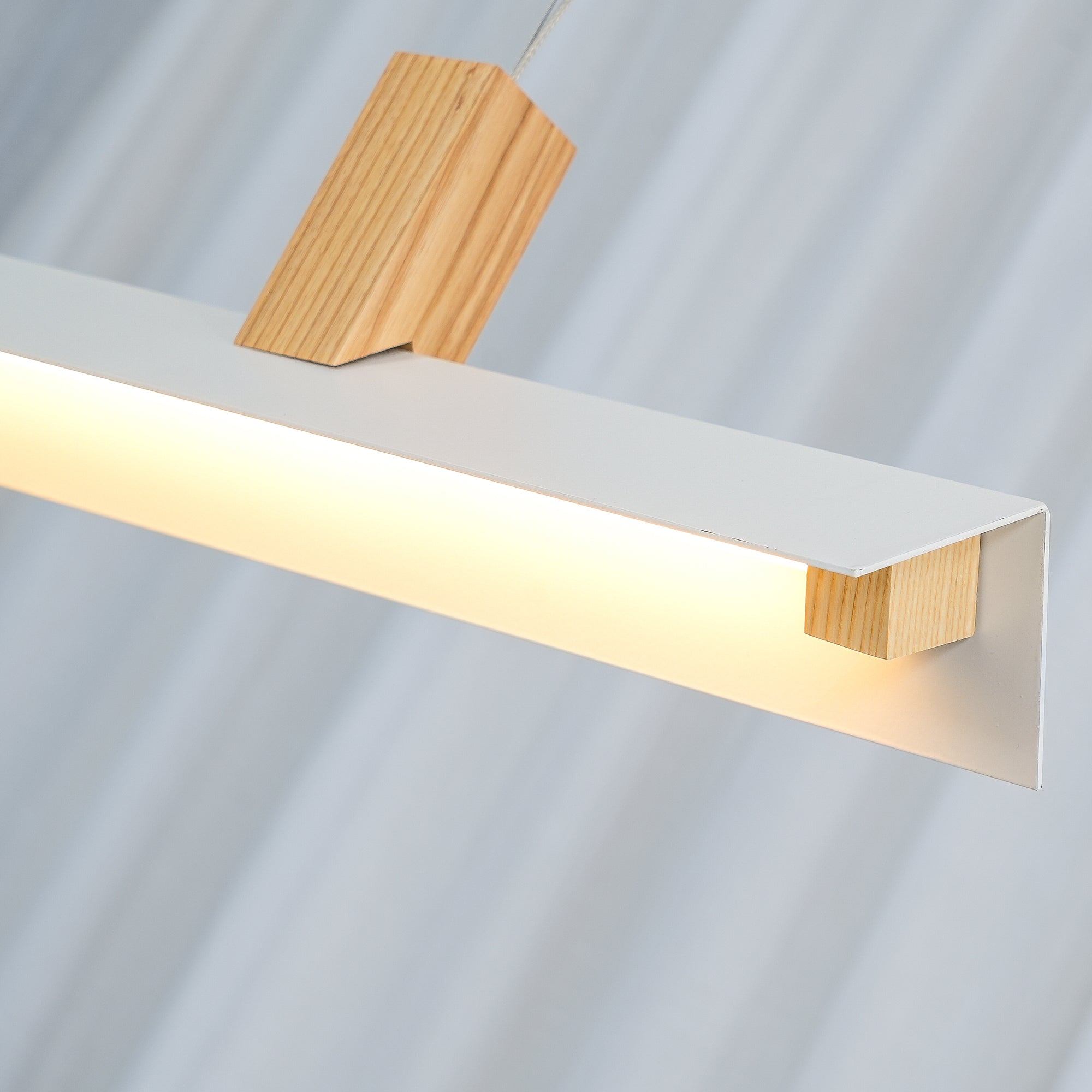 Wood-grain block above a White luminous channel