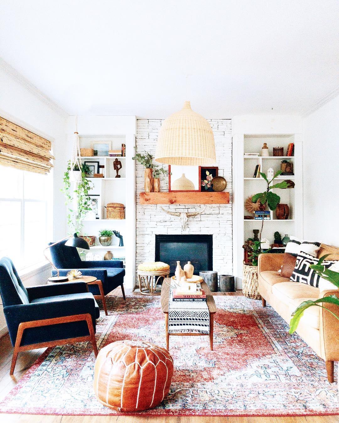Woven shade in a bright room with a blue chair