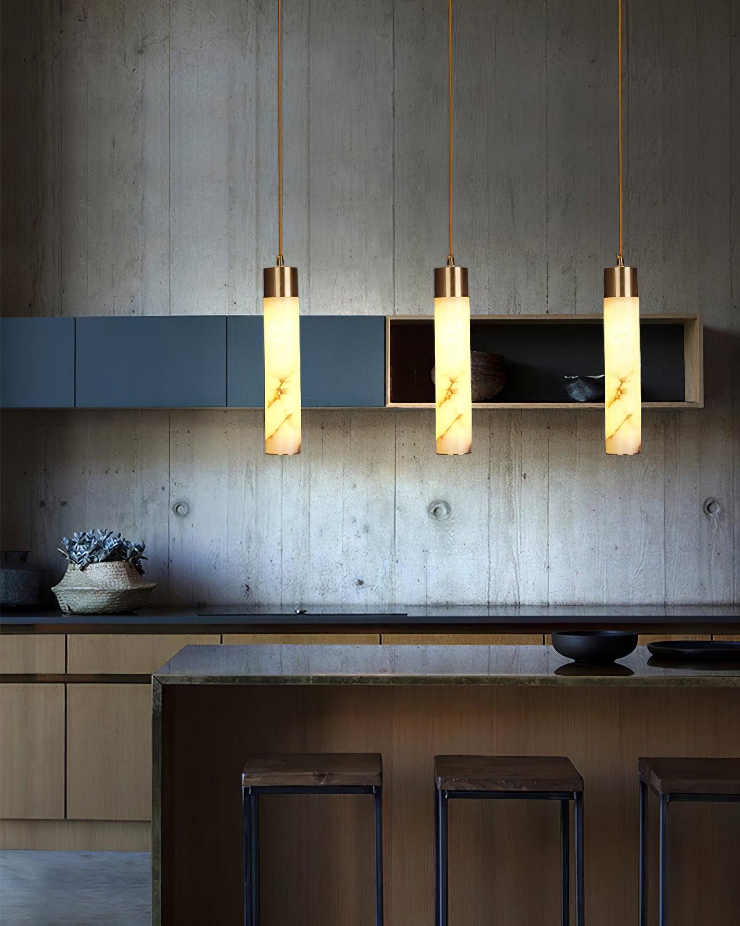 Three Tala tube pendants above a counter