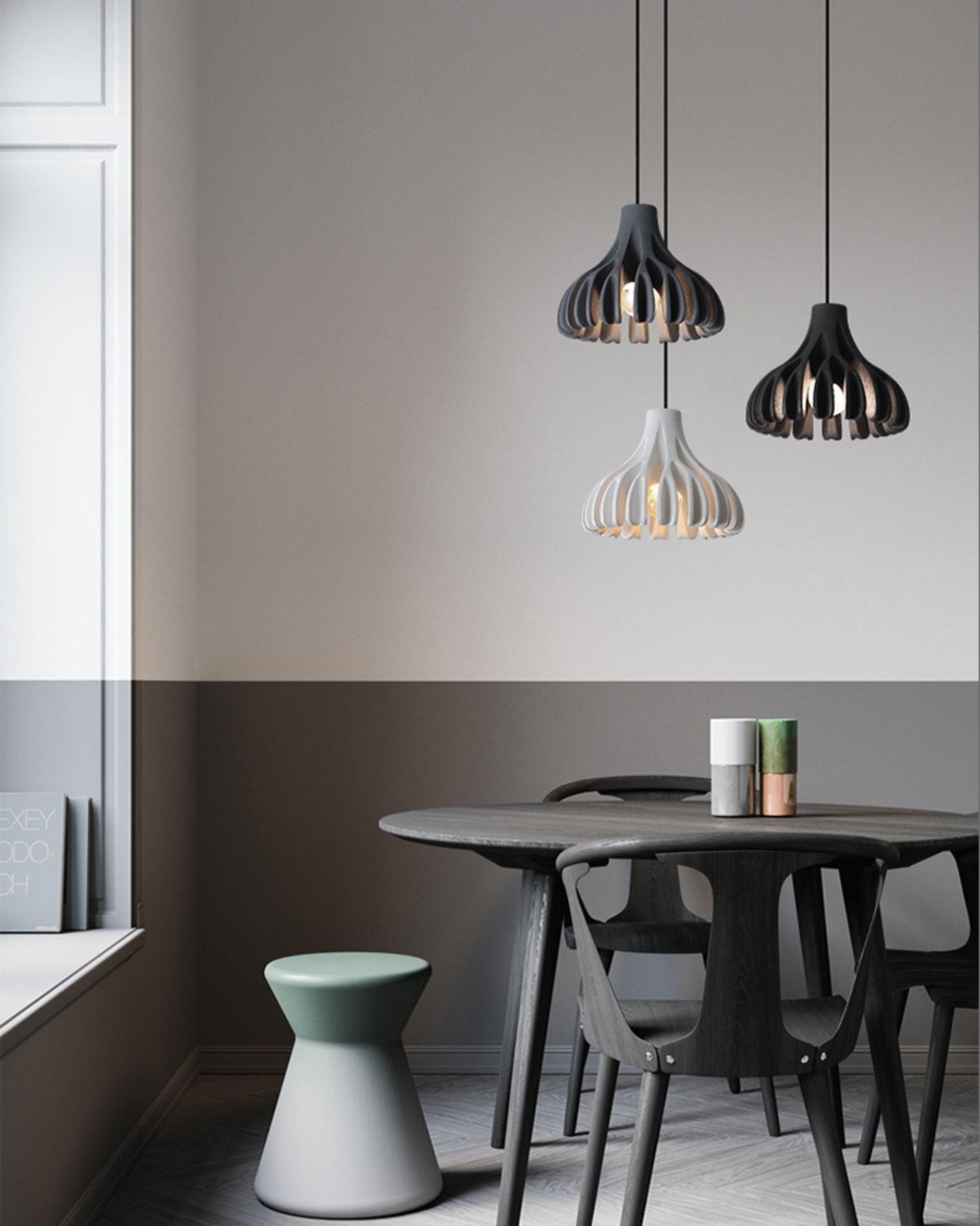 Grey White and Black pendants above dining furniture