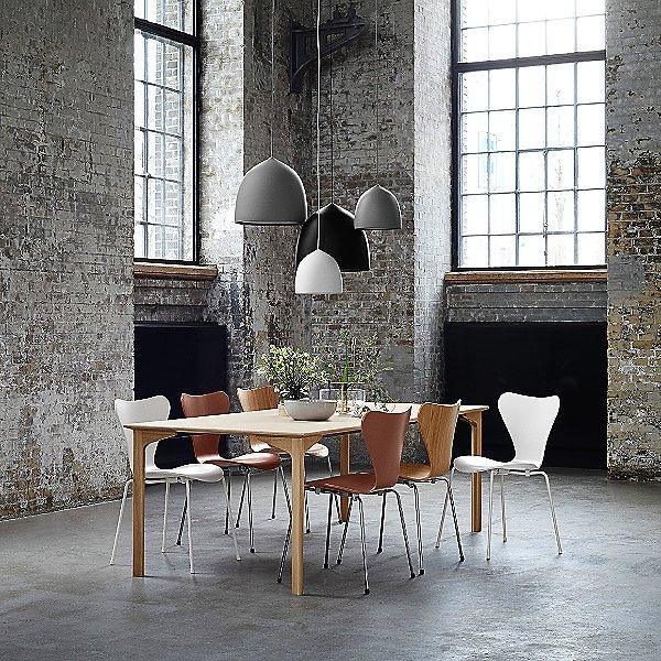 Mixed bell shades above a loft dining table