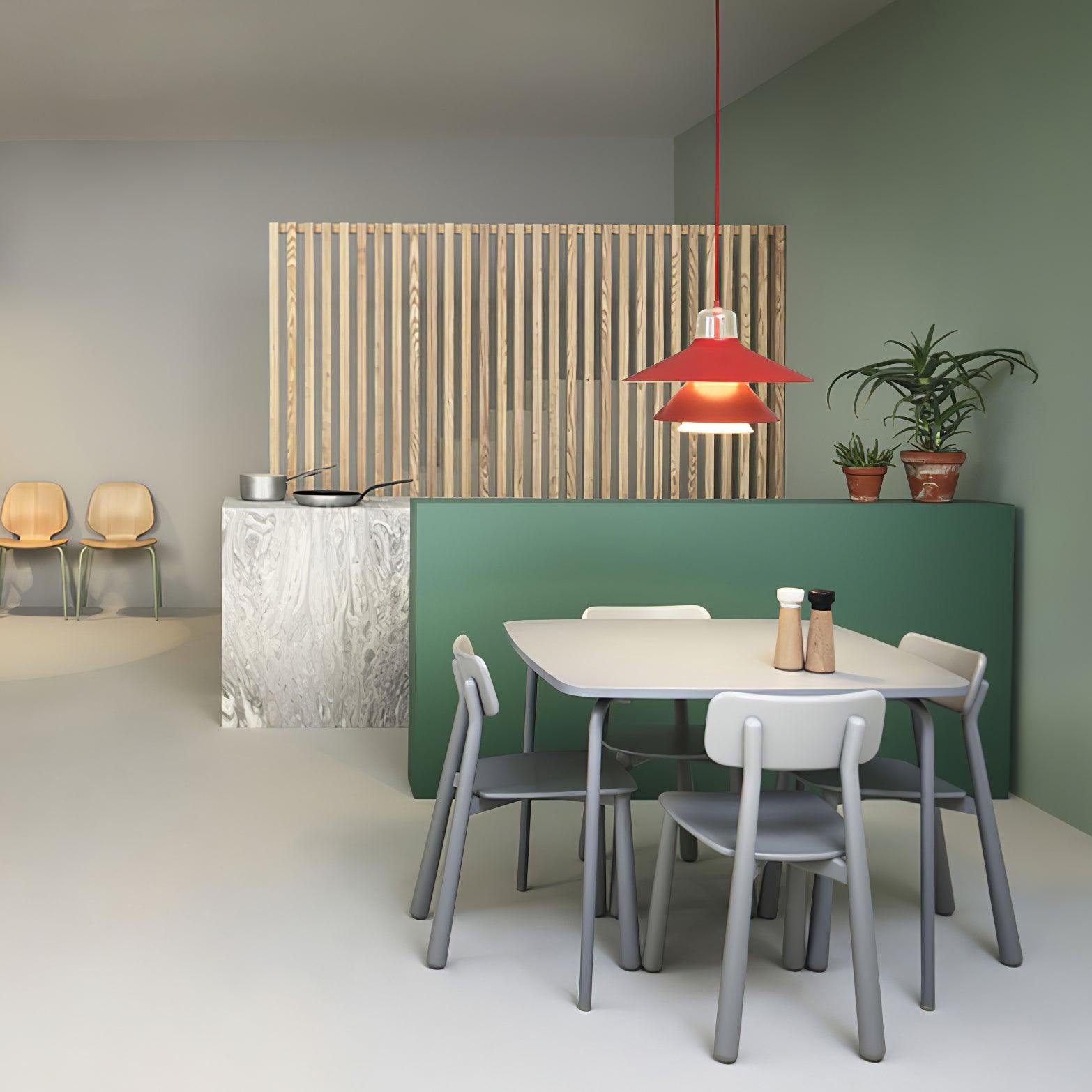 Red pendant over a round dining table