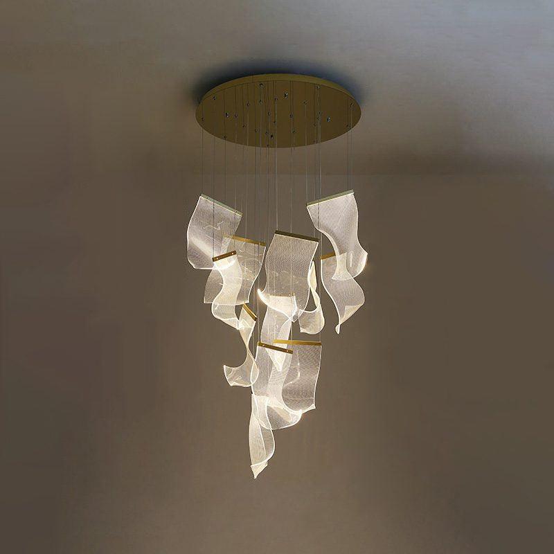 Twelve-head acrylic cascade glowing below a gold-coloured round canopy