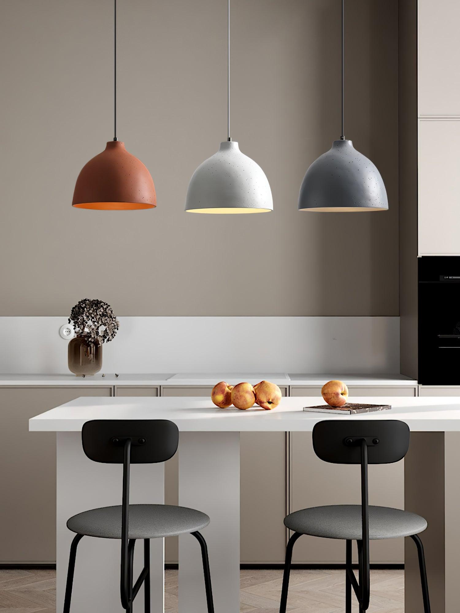 Orange white and grey lights over counter stools
