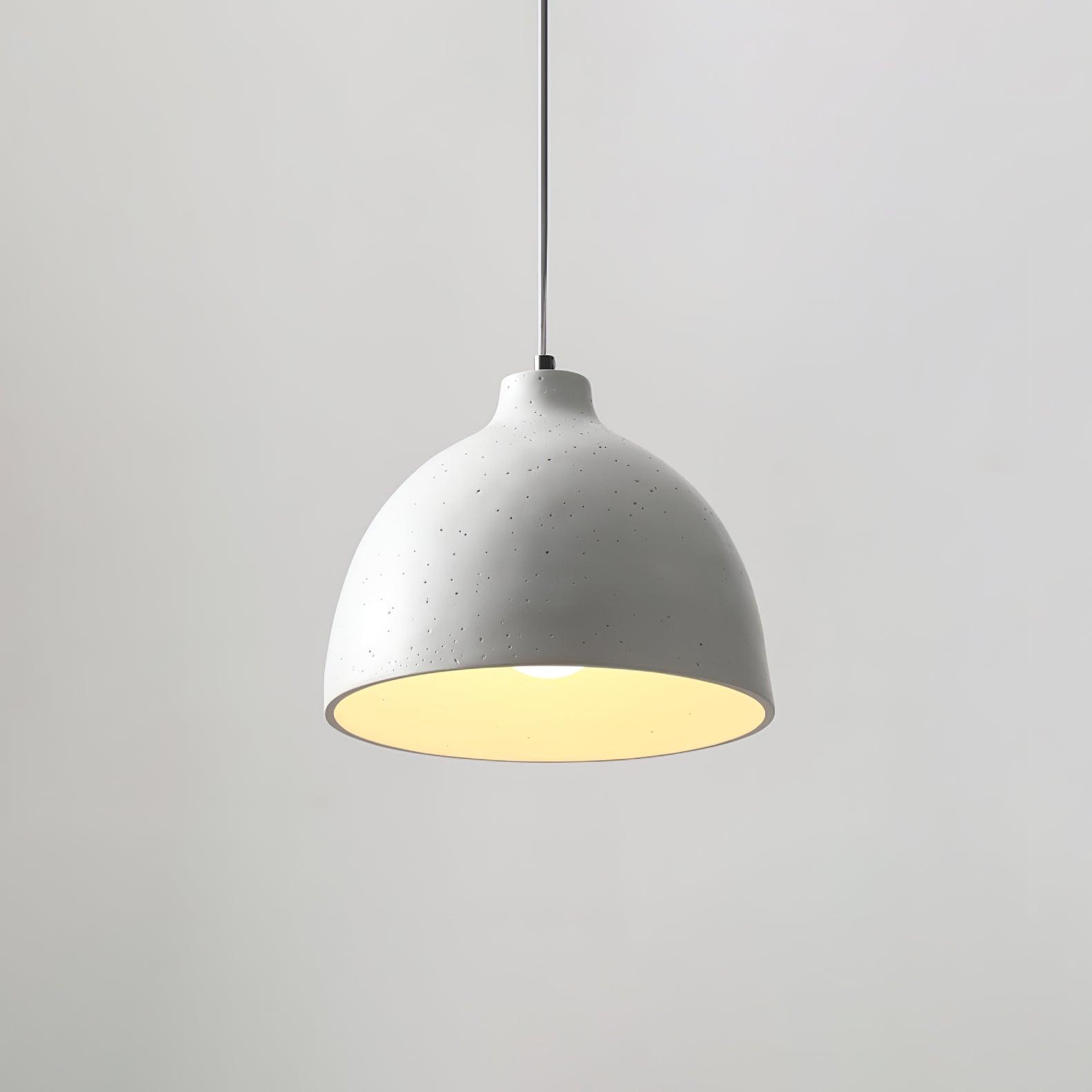 Illuminated white shade on a thin suspension cord