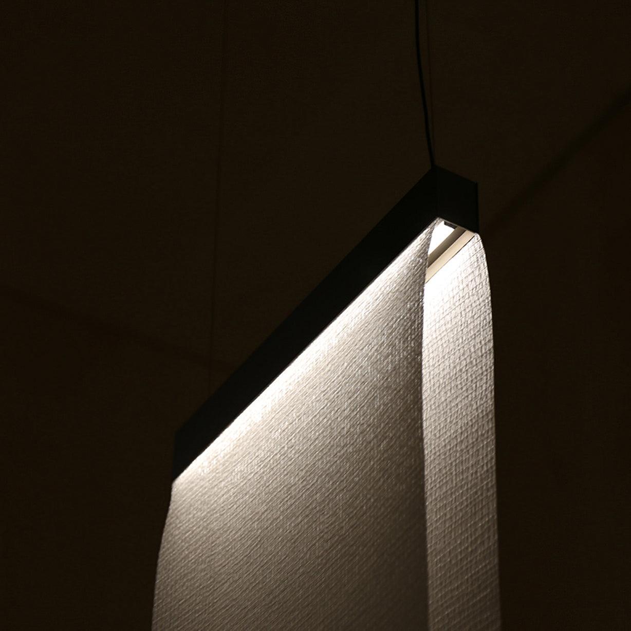 Light glowing along the top of textured fabric