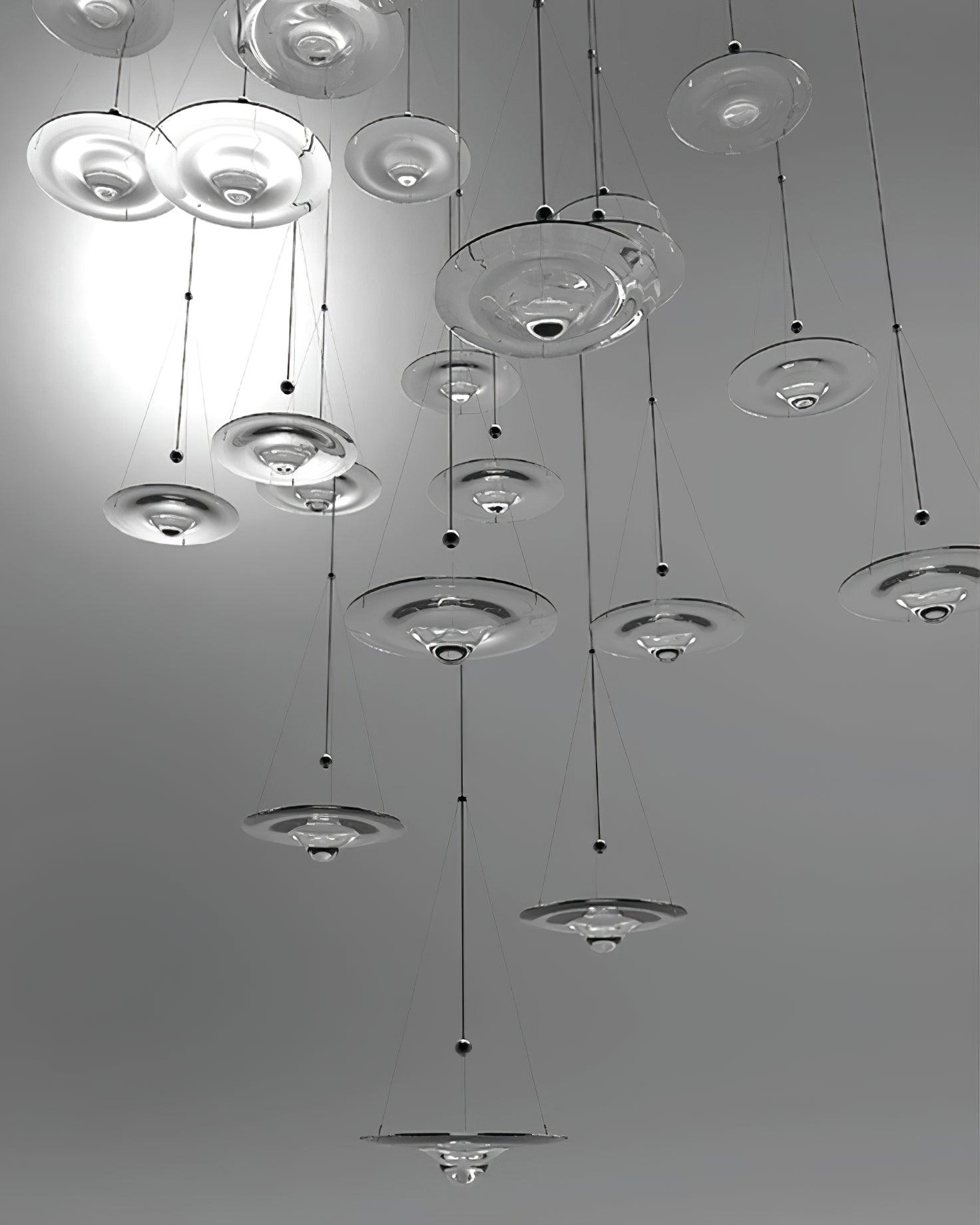 Many glass discs suspended in a tall group