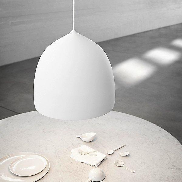 White bell pendant above a round table