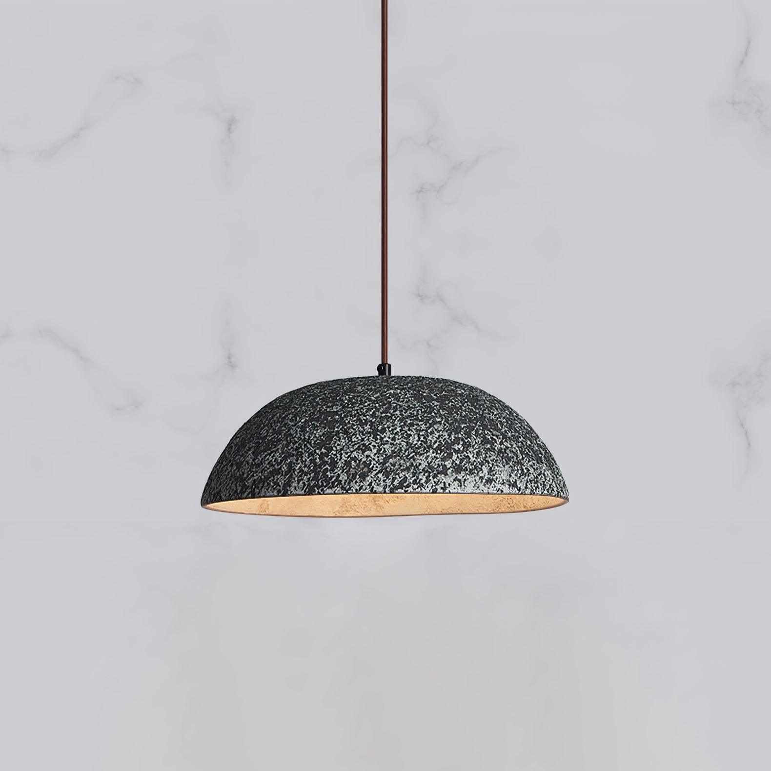 Black ceramic dome with a gold-toned underside