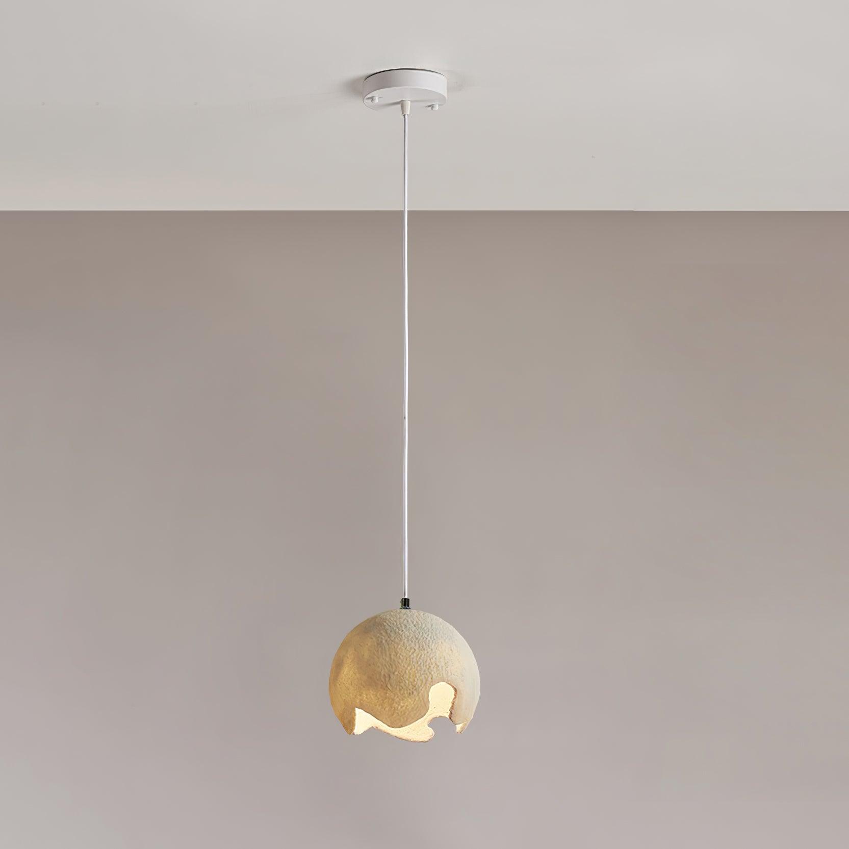 Small beige textured globe with a pale suspension cable and round canopy