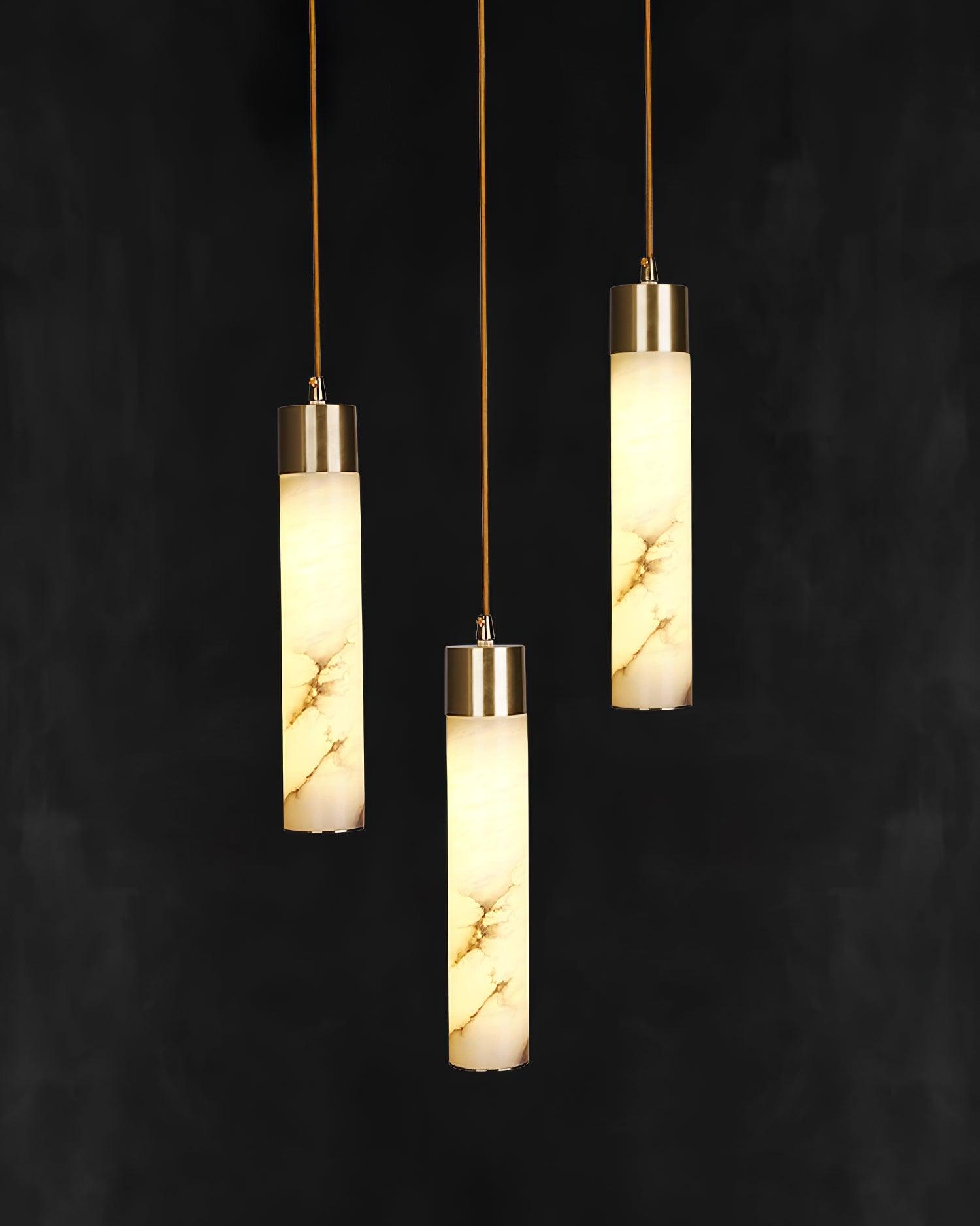 Three glowing stone tubes suspended at different heights