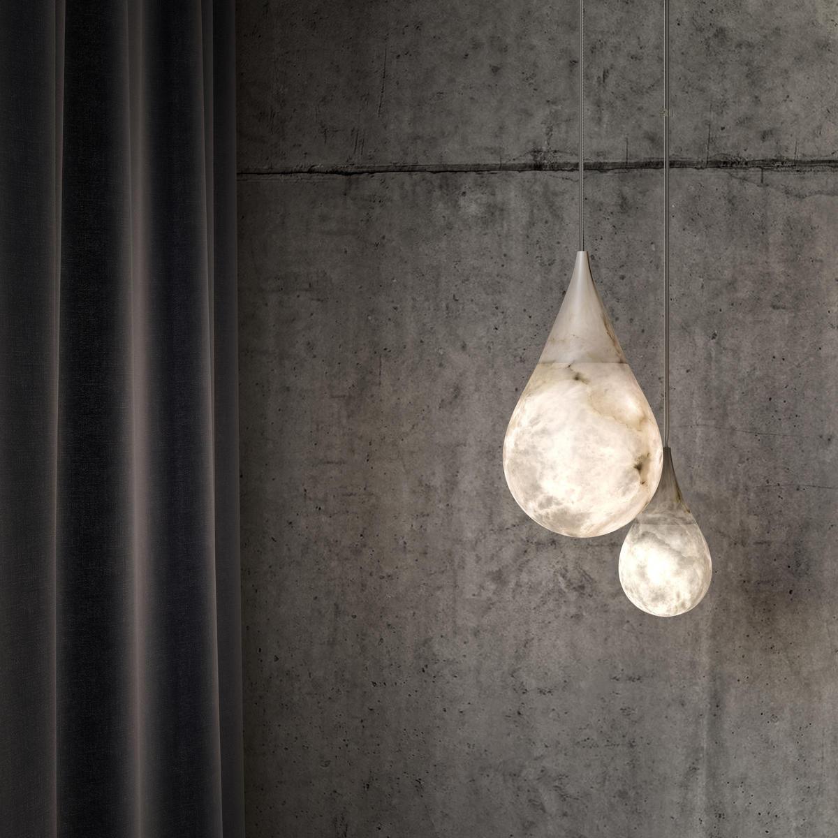 Marble pendant pair against a concrete wall