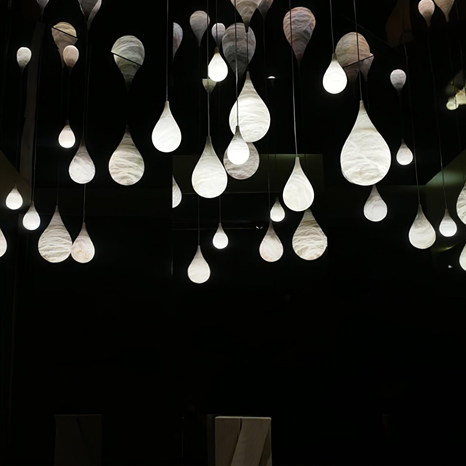 Display of many suspended marble teardrop lights