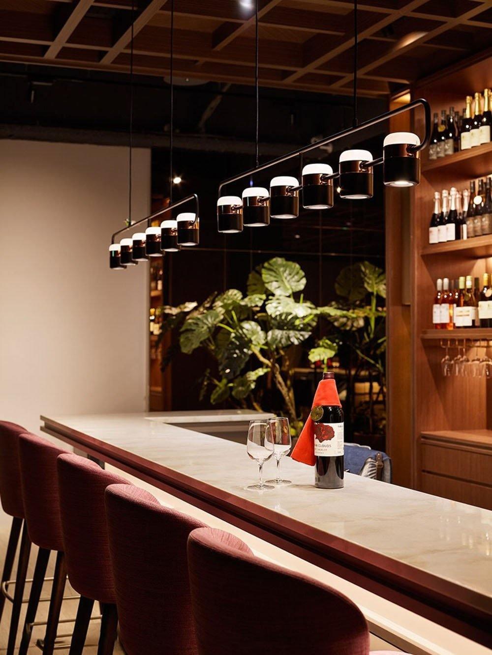 Geometric LED pendant light with adjustable cylindrical heads