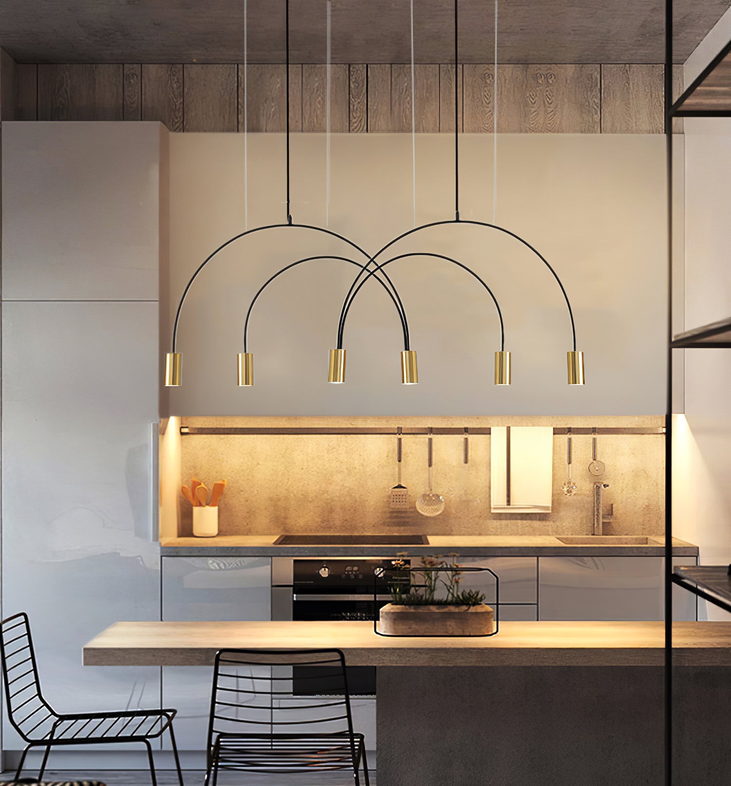 Arcs pendant above a kitchen counter and stools
