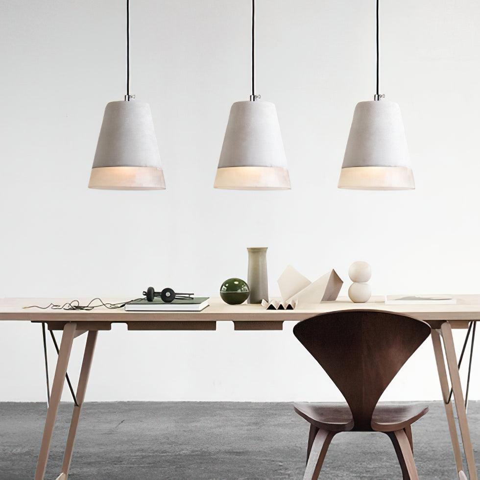 Row of tapered Delia shades above a long table