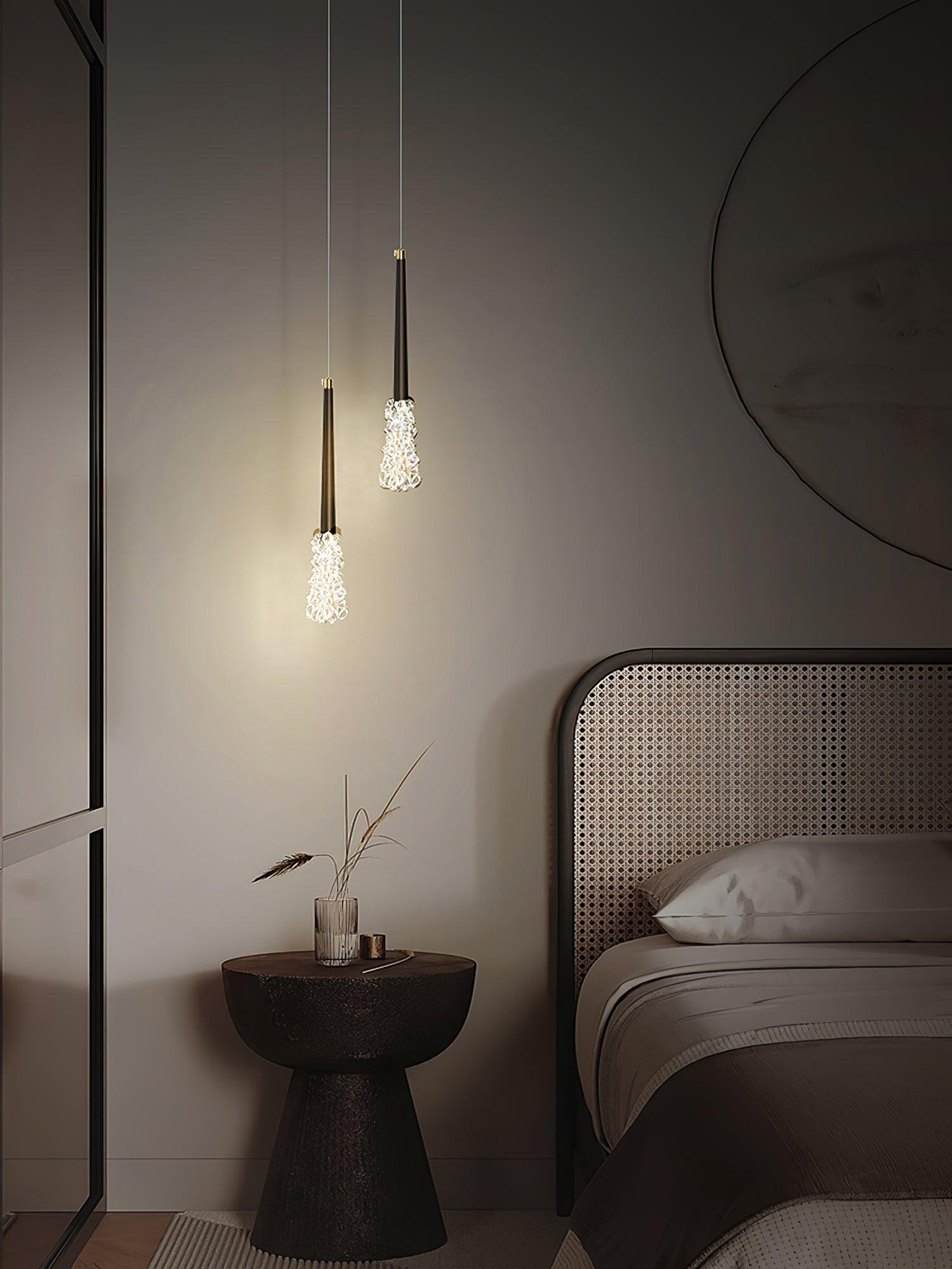 Dark-finish pendant pair beside a round mirror