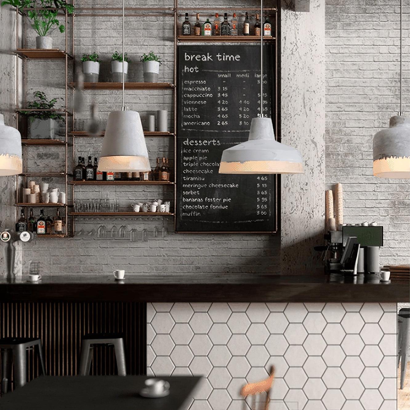 Cement-and-resin pendants above a café counter