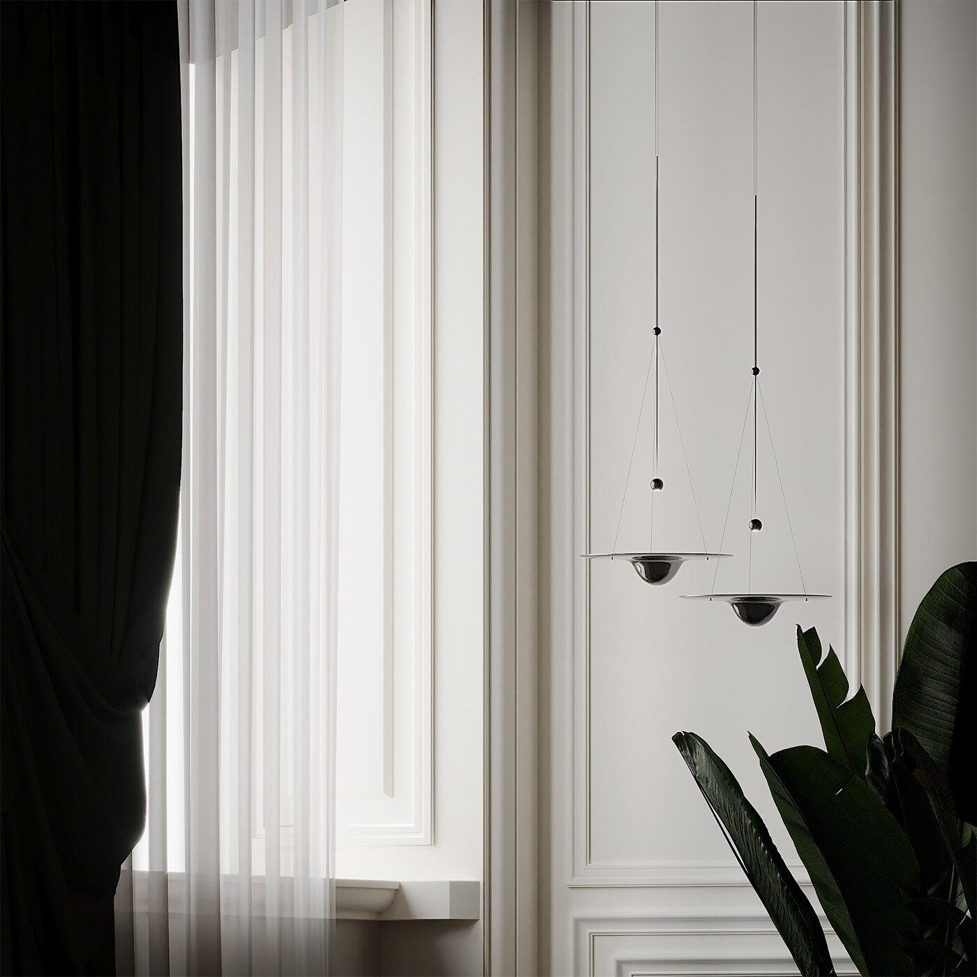 Small dark-looking glass pendants beside curtains