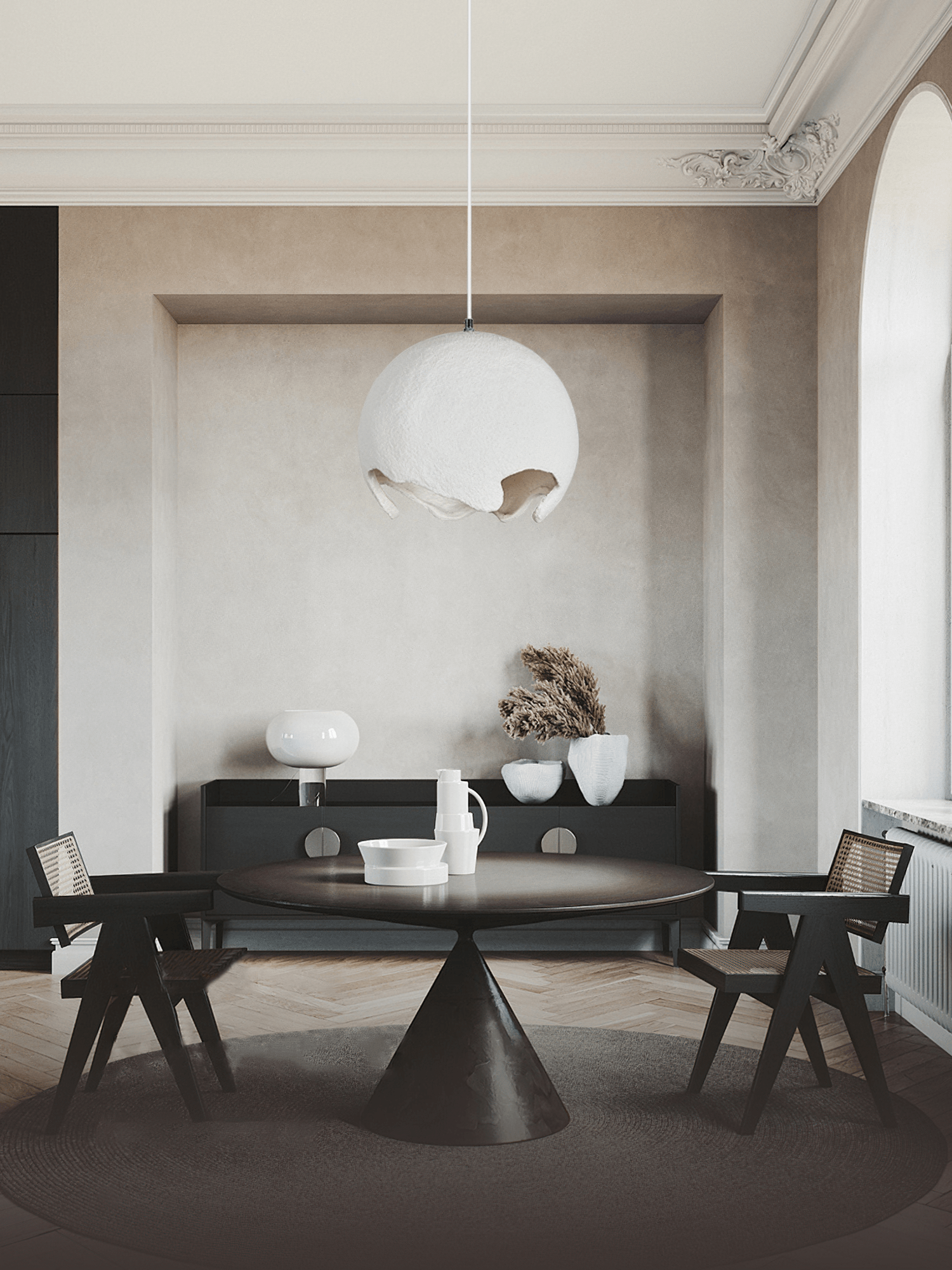 White resin pendant above a dark dining table