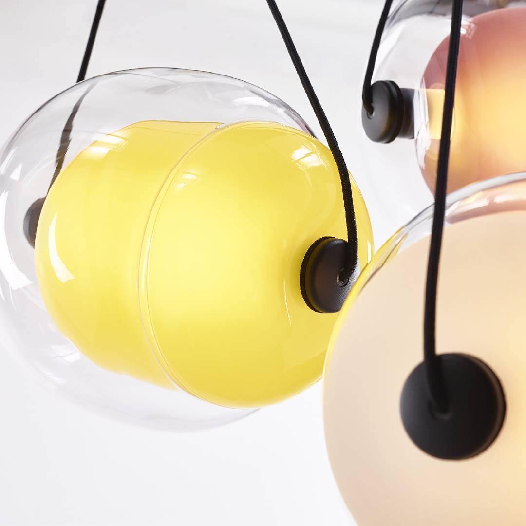 Yellow glass capsule with clear outer shell
