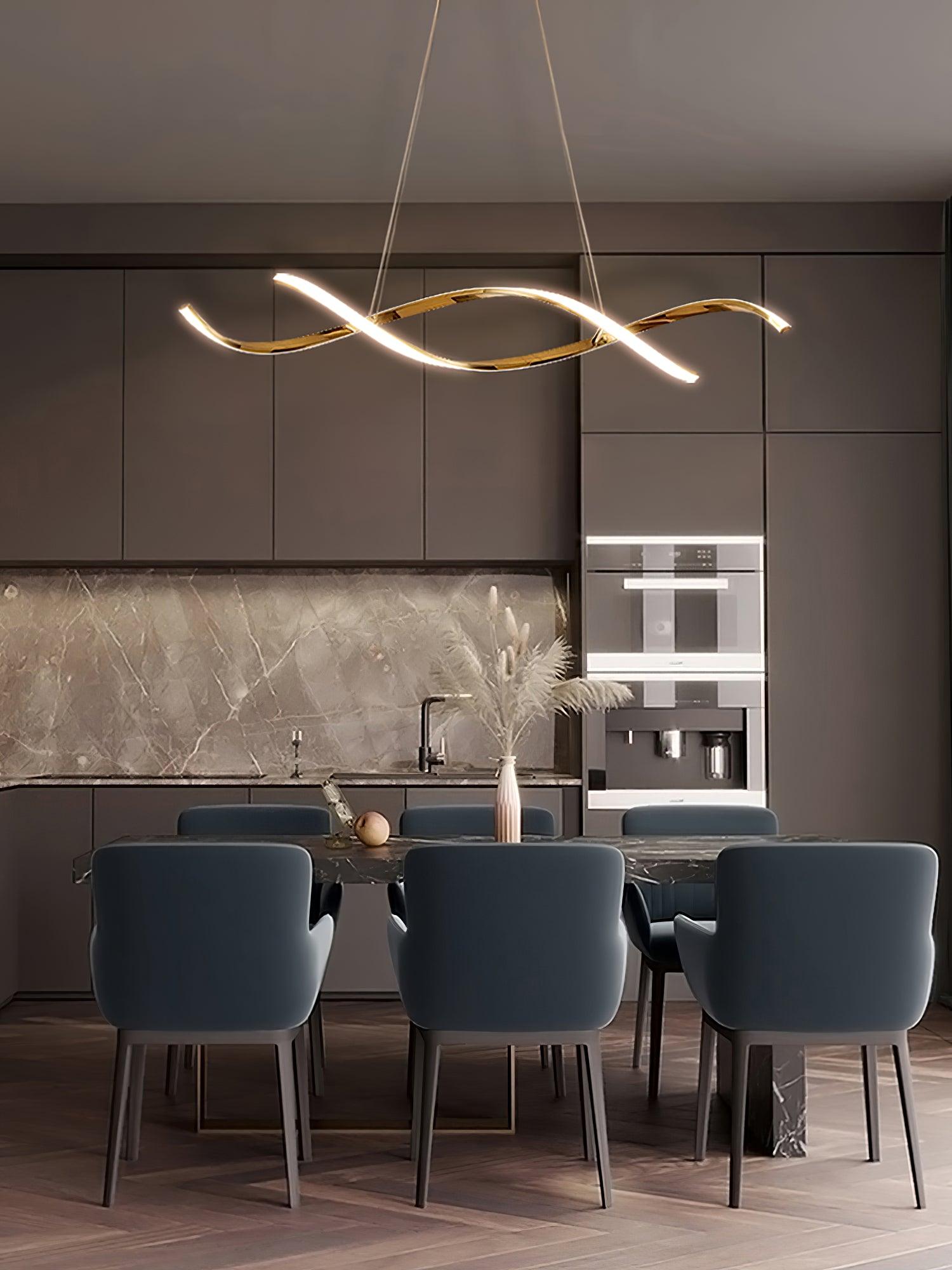 Glowing gold wave ribbons above a dark kitchen dining table with blue chairs