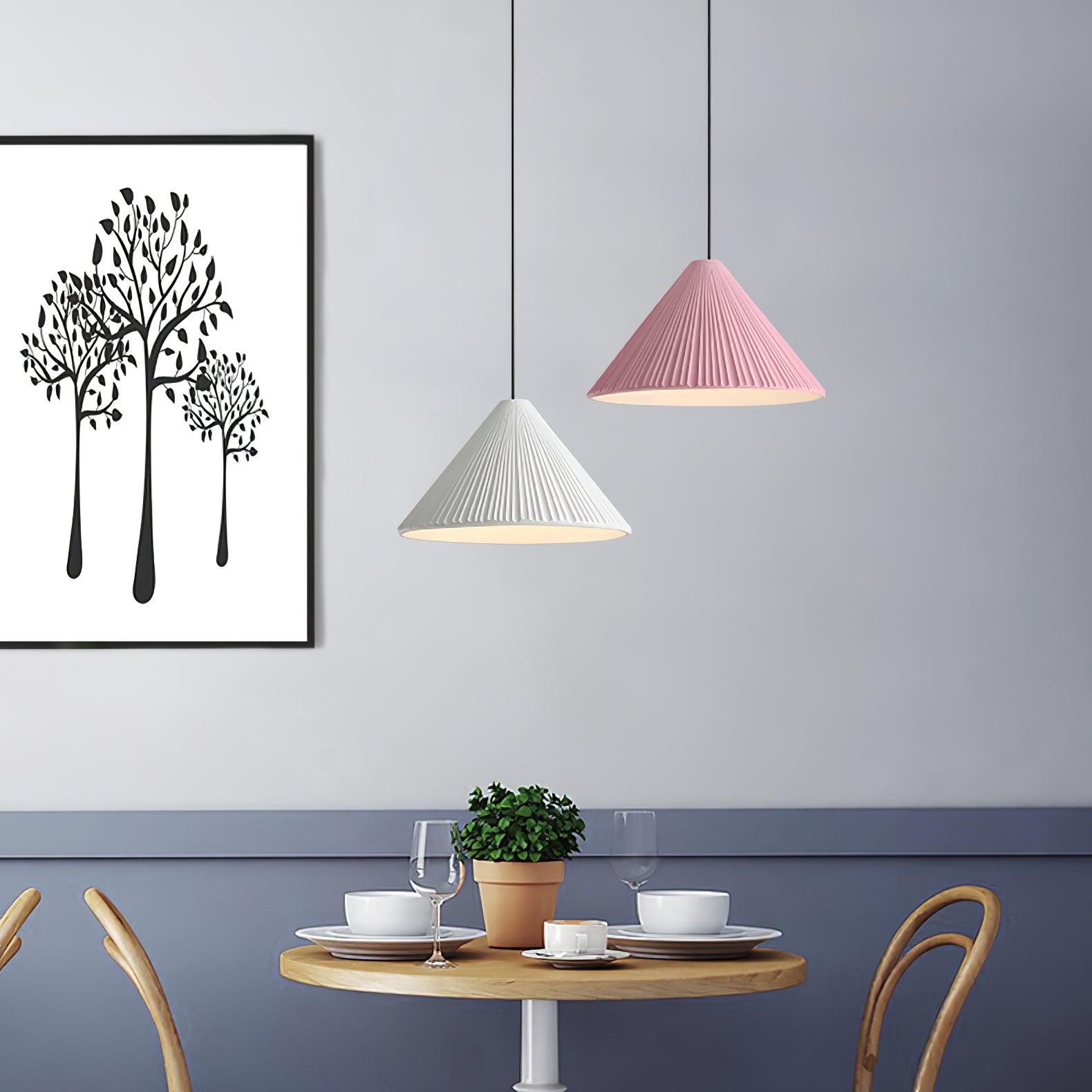 White and Pink Hat pendants above a dining table