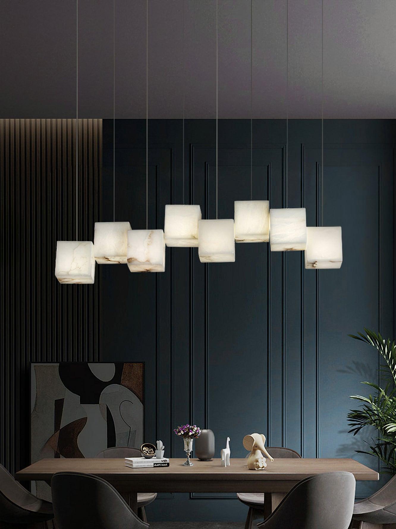 Gold linear pendant with suspended White cubes