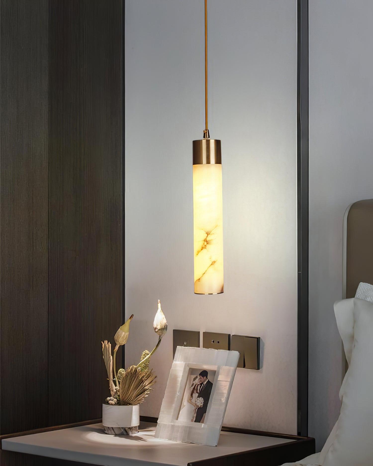 Single Tala pendant above a bedside surface