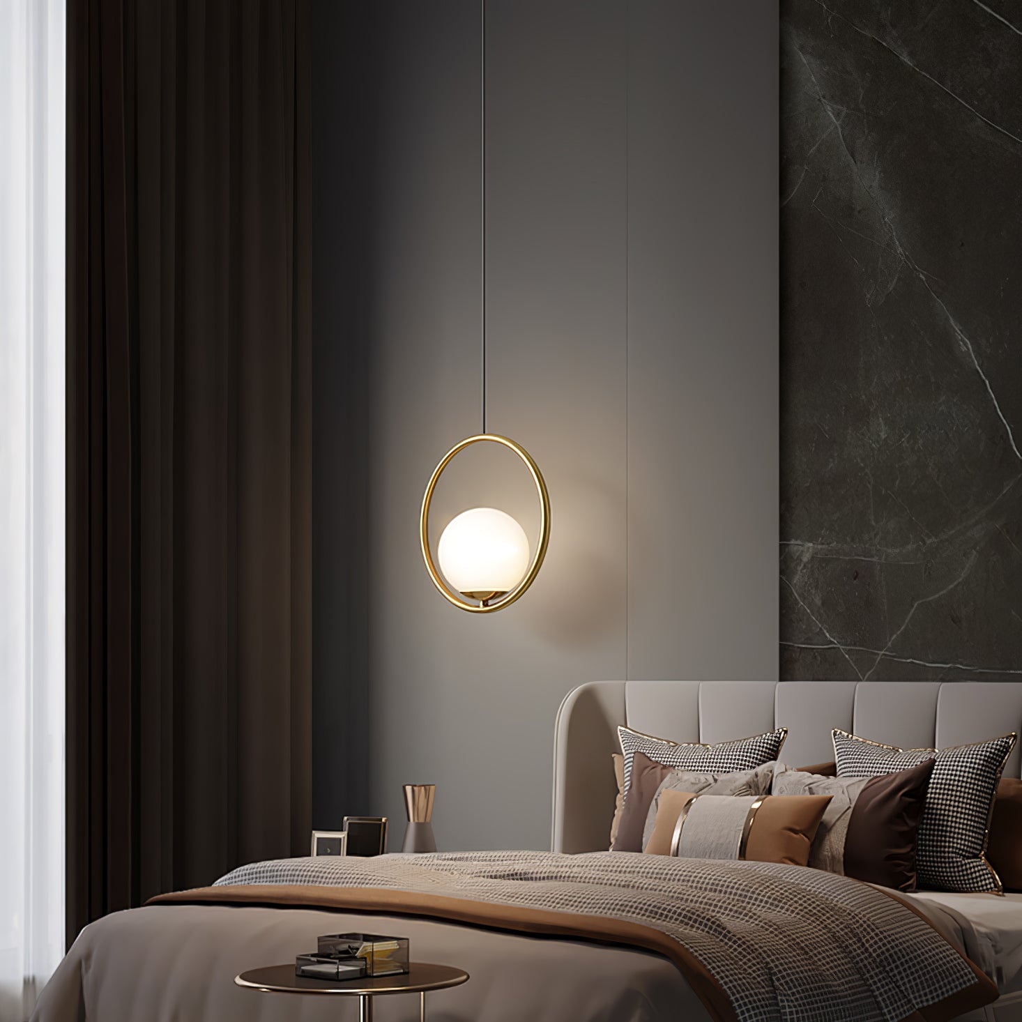 Round frame globe pendant beside a bed