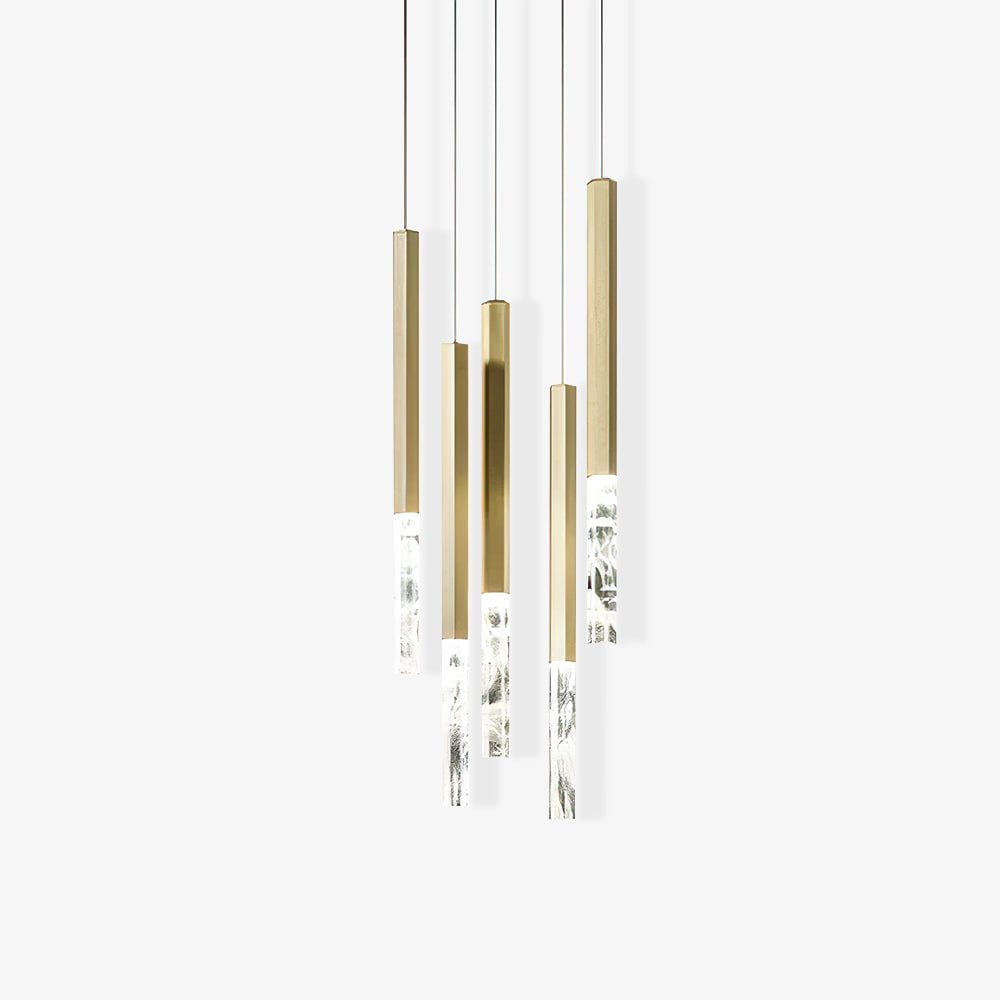 Five gold-tone pendant shafts and clear tips at staggered heights with shadows on a white background