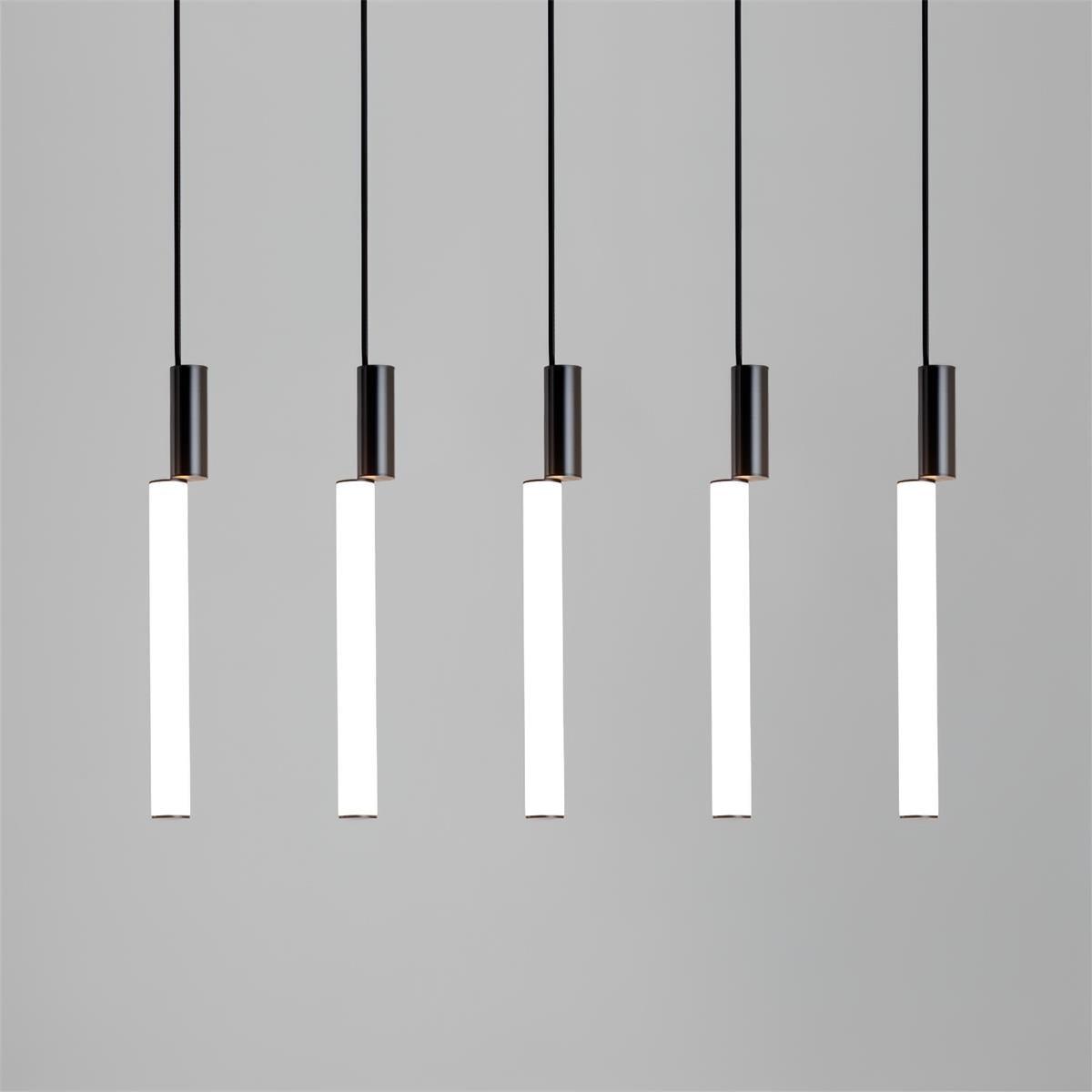 Five white acrylic light bars with black upper cylinders suspended in a straight row