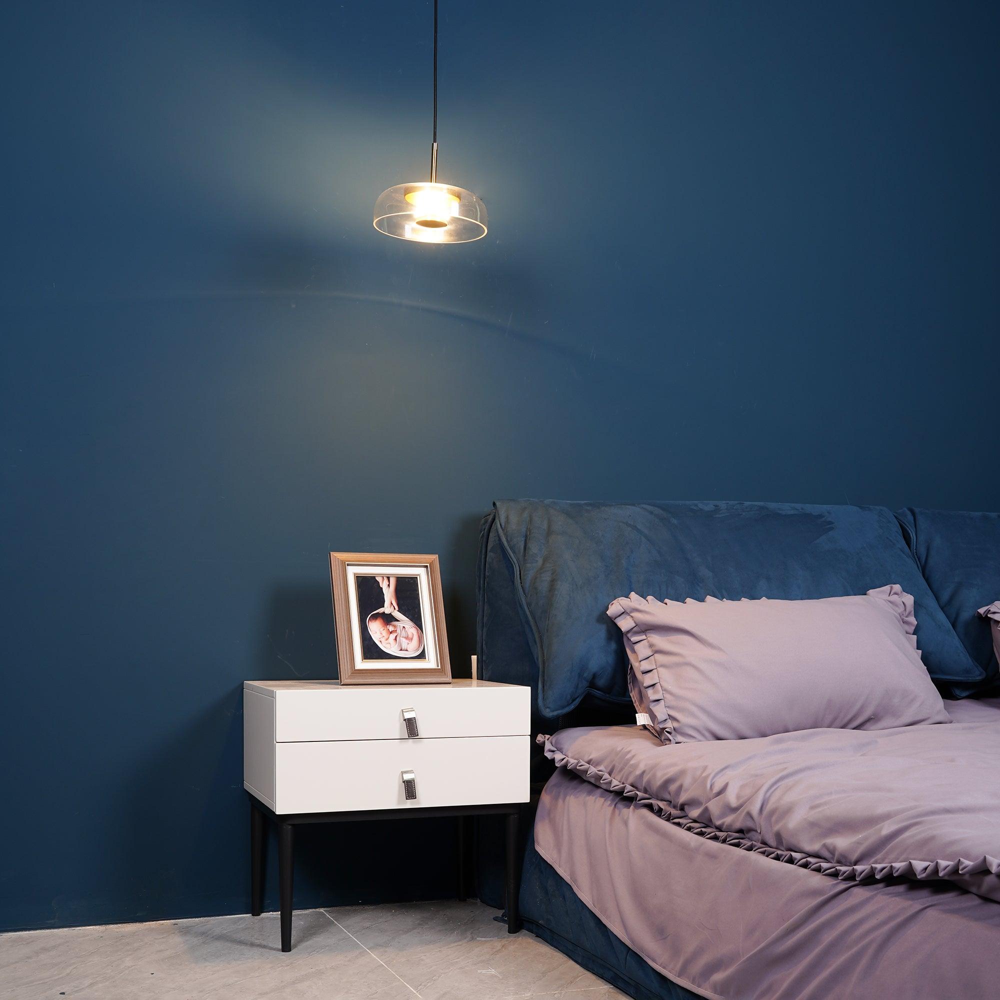 Blossi pendant light with a glass dome and circular inner metal elements