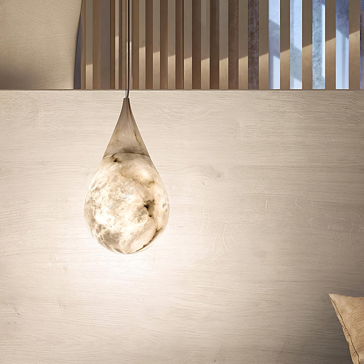 Single marble pendant above a bedside table