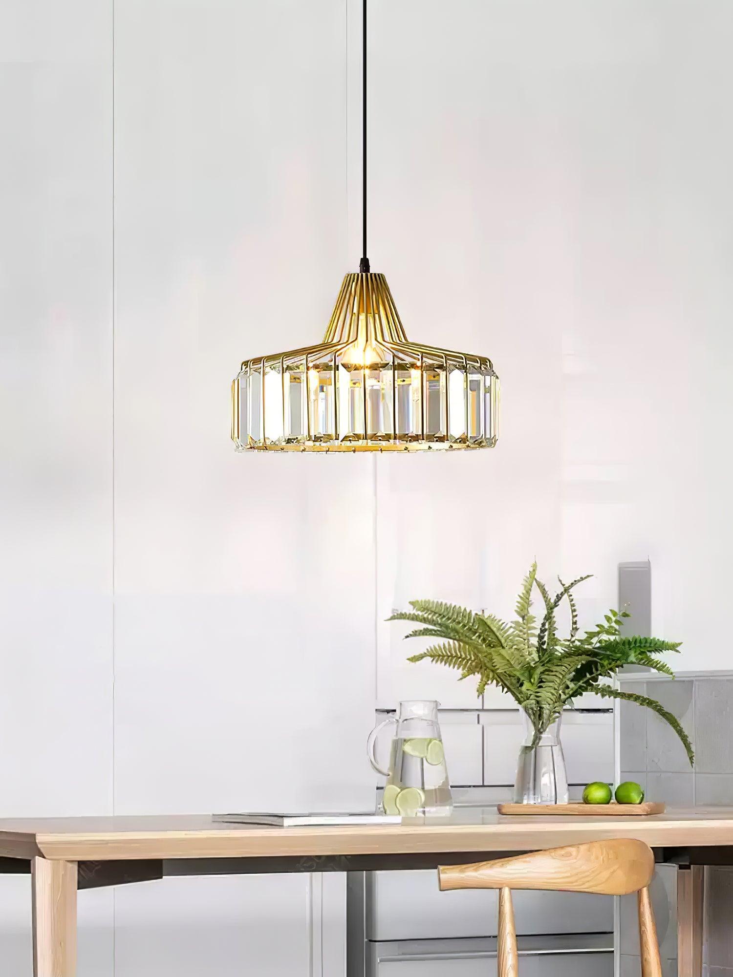 Gold-coloured drum pendant above a narrow table